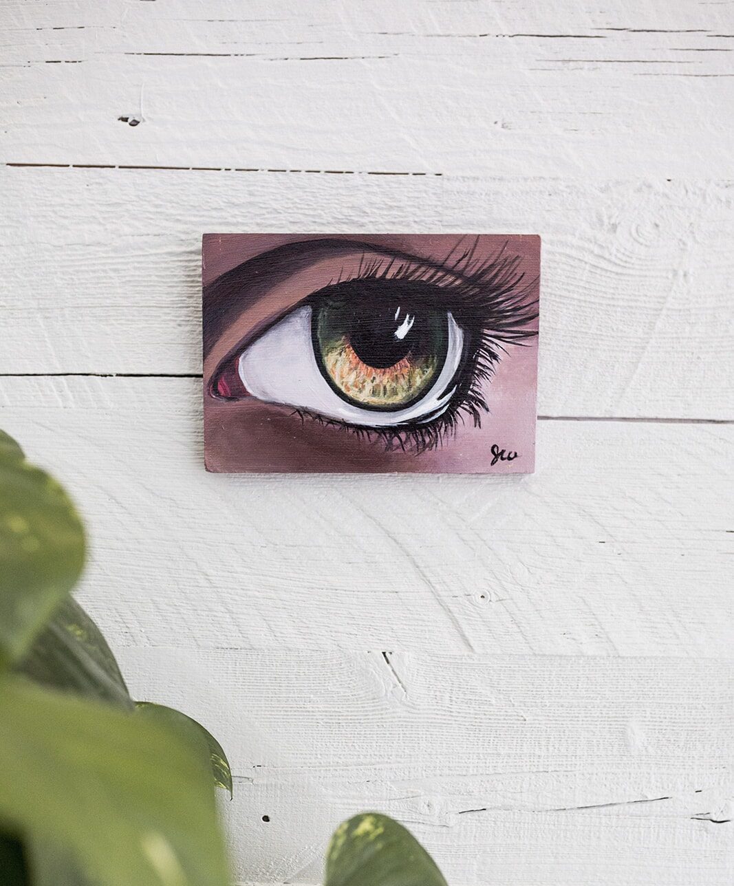 eye painting on white wall